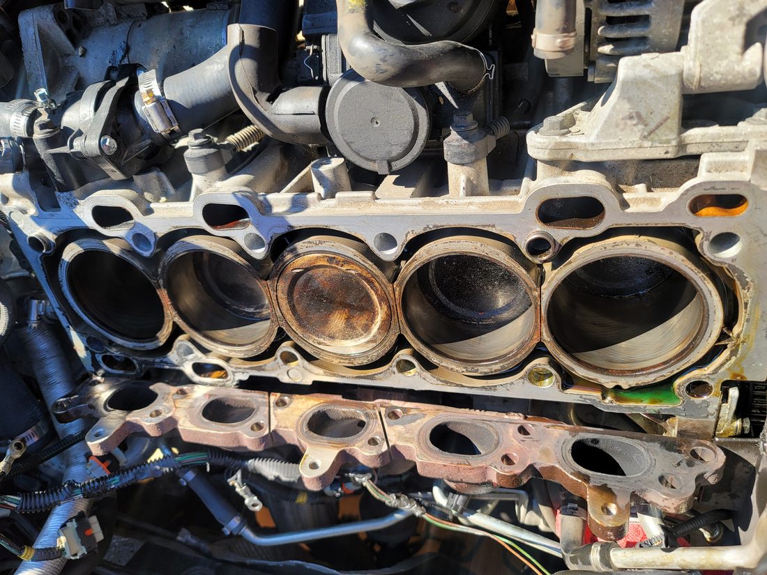 Close-up of an engine cylinder head during a repair