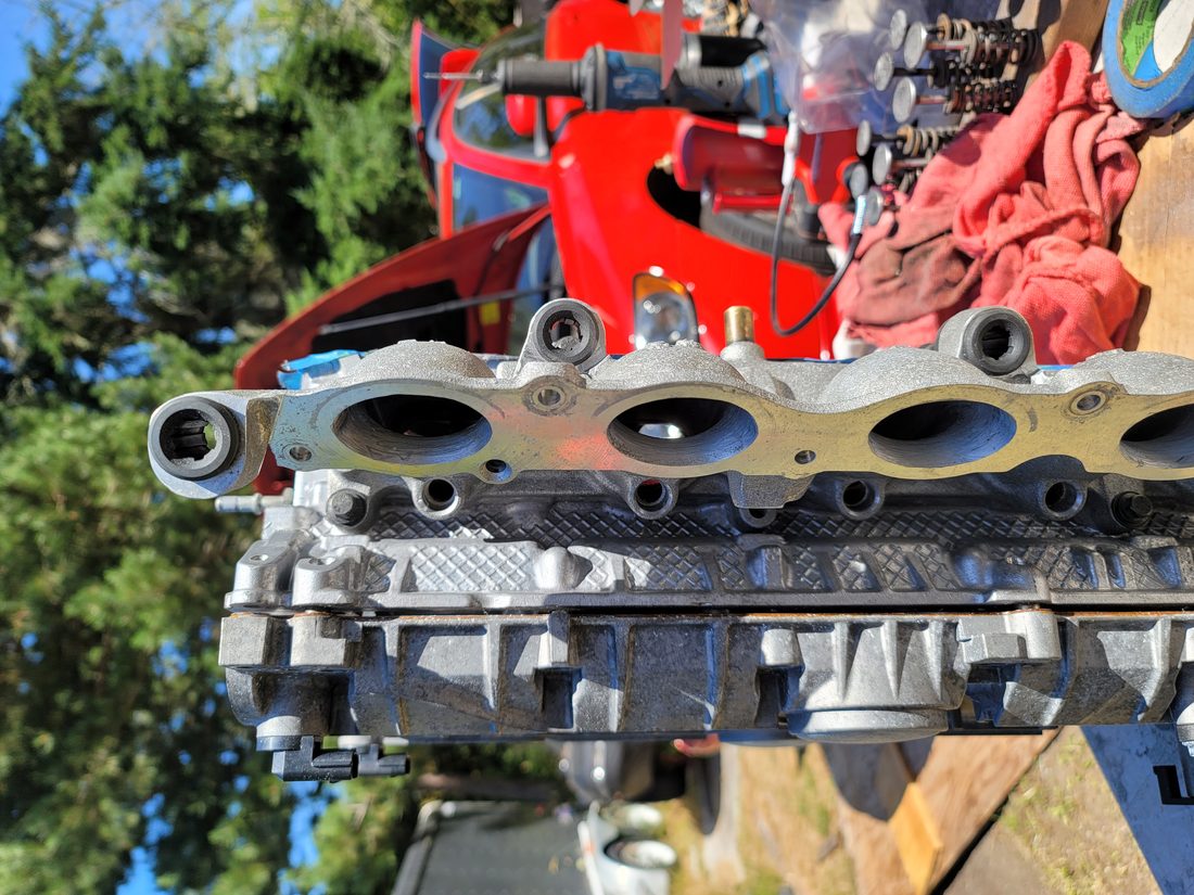Intake manifold component being serviced